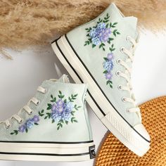 '' Custom Embroidered Converse High Tops, Blue Flower Embroidered Converse Shoes, Blue and Purple flowers Embroidered Sneakers Custom, Unique Gifts for Her '' 🍀 Price includes Converse Shoes and Floral Embroidery Designs as shown 🍀 🍀 Shoe Type: Converse 1970s 🍀 Shoe color:9. Summit Sage_1970s 1. DETAILS 🍀 You can send me your Converse, Vans, canvas shoes or I can buy them for you. Custom-ordered embroidered Vans and Converse shoes, please wait another 2-4 days. Each pair is hand embroidered to order, please make sure you put in the correct shoe size before you check out. The embroidery is meticulous and does not fade. 🍀 You will receive Vans and Converse shoes with floral embroidery designs as above. 2. PERSONAL EXPRESSION 🍀 Create your unique vibe by your own design of embroidery! Converse Embroidery Floral, Floral Converse Lyst, Ambroidered Flower Shoes, Embroidered Low Converse, Flower Custom Converse, Bridal Converse Custom, Floral Converse Custom, Embroidered Converse High Tops, Embroidered Vans