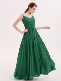 a woman in a long green dress