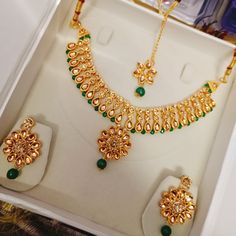 Step into the realm of bridal elegance with our exquisite Green Bridal Choker Necklace Earring Set, a stunning ensemble designed to adorn you with sophistication and grace on your special day. Crafted with meticulous attention to detail, this set features a luxurious choker necklace adorned with green pearls, complemented by matching earrings. Our Indian Pearls Fancy Choker Necklace Studs Set exudes opulence and charm, perfect for adding a touch of glamour to your bridal ensemble. Whether you're Kundan Bridal Necklace With Matching Earrings For Wedding, Gold Kundan Necklace With Matching Earrings For Wedding, Green Hand Set Jewelry For Marriage, Green Hand-set Jewelry For Marriage, Kundan Jewelry Sets For Wedding With Elegant Design, Kundan Jewelry Sets With Elegant Design For Wedding, Elegant Jewelry Sets For Marriage And Festive Occasions, Elegant Festive Jewelry Sets For Marriage, Bridal Necklace With Matching Earrings For Wedding