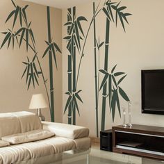 a living room with a television and wall decals on the walls that say home & garden essentials