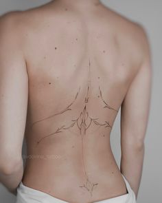 the back of a woman's body with lines drawn on it