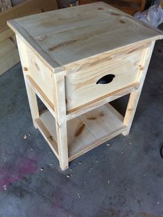 a small wooden table sitting on top of a floor