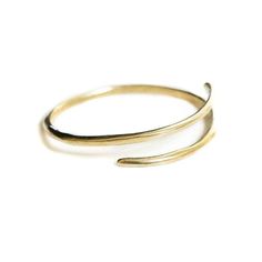 Brass or sterling silver bangle that wraps around wrist. Approximately 2 inches in diameter, can be adjusted by bending tighter or stretching wider. Adjustable Round Jewelry With Modern Twist, Adjustable Round Jewelry With A Modern Twist, Adjustable Round Modern Twist Jewelry, Adjustable Modern Twist Bracelet, Elegant Hand Forged Adjustable Bangle, Hand Forged Minimalist Bangle Jewelry, Minimalist Hand Forged Bangle Jewelry, Minimalist 14k Gold Open Ring Bracelets, Hand Forged Minimalist Bangle