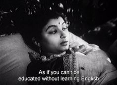 a woman laying on top of a bed next to a tree with a quote above her that reads, as if you can't be educated without learning english