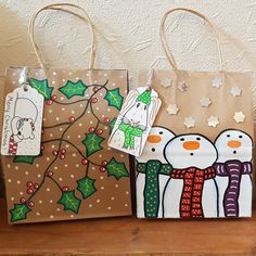 three bags decorated with snowmen and christmas decorations