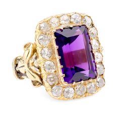 Center Stone: AmethystCut: Emerald CutWeight: Approximately 7.5 CaratsColor: PurpleAccent Stone: 18 DiamondsCut: Old Mine Weight: Approximately 3.5 CaratsColor: HClarity: SIMetal: 18K Yellow GoldEra: AntiqueCirca: 1900sSize: 4.5 and can be resizedGram weight: 15.62Technical Description:This ring features an emerald cut amethyst as the center stone, weighing approximately 7.5 carats, with a purple color. The accent stones include 18 old mine cut diamonds, totaling approximately 3.5 carats, with H Luxury Yellow Gold Amethyst Ring With Rose Cut Diamonds, Formal Yellow Gold Amethyst Ring With Rose Cut Diamonds, Formal Rose Cut Amethyst Ring In Yellow Gold, Fine Jewelry Purple Amethyst Ring With Rose Cut Diamonds, Heirloom Purple Diamond Ring For Formal Occasions, Purple Heirloom Diamond Ring For Formal Occasions, Formal Purple Amethyst Ring With Rose Cut Diamonds, Formal Heirloom Purple Diamond Ring, Luxury Amethyst Rings With Rose Cut Diamonds