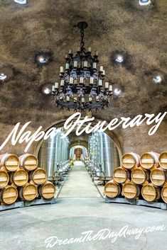 a wine cellar with barrels and chandelier for napa d'arcray