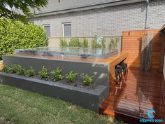 an outdoor hot tub on a wooden deck