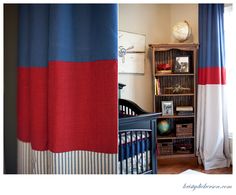 a baby's room is decorated in red, white and blue