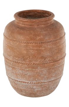 a large brown vase sitting on top of a white surface