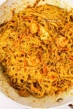 shrimp chow mein in a white bowl with chopsticks on the side, ready to be eaten