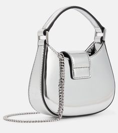 The Bow Micro leather tote bag in silver - Self Portrait | Mytheresa Silver Shoulder Bag With Top Handle And Chain Strap, Silver Shoulder Bag With Top Handle And Detachable Handle, Chic Silver Bag With Detachable Handle, Silver Crossbody Evening Bag With Chain Strap, Luxury Silver Shoulder Bag With Detachable Handle, Luxury Silver Bag With Double Handle, Silver Handheld Evening Bag With Chain Strap, Handheld Silver Evening Bag With Chain Strap, Luxury Silver Double Handle Bag