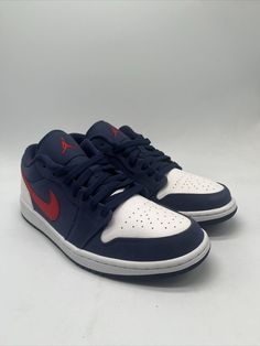 Elevate your game with these limited edition Nike Air Jordan 1 Low SE sneakers. Designed for both athletic and casual wear, these sneakers feature a solid blue colorway with red accents and a durable leather upper. The lace-up closure ensures a secure fit, while the cushioned insole and breathable lining provide all-day comfort. These sneakers are perfect for any season, whether you're hitting the gym, going to school, or playing basketball with friends. With a standard shoe width and rubber outsole, they are sure to provide both performance and style. Get your hands on these Air Jordans today and step up your sneaker game. Basketball With Friends, Red Basketball Shoes, Nike Air Jordan 1 Low, Playing Basketball, Sneaker Games, Nike Air Jordan 1, Air Jordan 1 Low, Jordan 1 Low, Red Accents