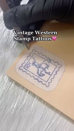 the stamp is being used to make a tattoo on a sheet of plastic wrapper