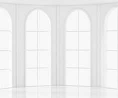 an empty white room with three arched windows