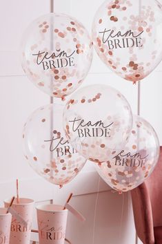 balloons and streamers with team bride written on them