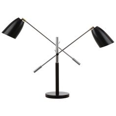 the three light table lamp has two black lamps on each side and one is turned on