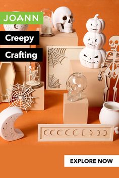 there are many halloween decorations on the table and in front of it is an advertisement for joann creepy crafting