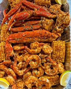 grilled shrimp and corn on the cob with lemon wedges