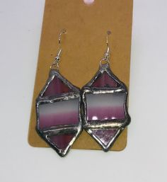 2 inches by 1 inches. There are two pairs that are sold separately. They are made from two triangles and one rectangle. One is in pink glass while the ther is in yellow. Pink Glass, Jewelry Earrings Dangle, Dangle Drop Earrings, Dangle Earrings, Jewelry Earrings, Yellow, Drop Earrings, Pink