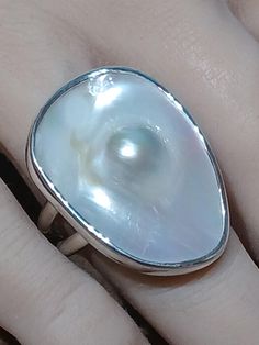 One of a kind, handcrafted, Blister Pearl and sterling silver ring. Size 9.5(one free sizing). Top measures about 30mm X 22mm. White Oval Dome Ring For Gift, White Oval Dome Ring Gift, Sterling Silver Concave Dome Ring As Gift, Unique White Rings With Polished Finish, Unique Polished Pearl Ring Gift, Unique Polished Pearl Ring As Gift, Unique Polished Pearl Ring For Gift, Unique Oval Pearl Ring In Sterling Silver, Artisan White Sterling Silver Ring