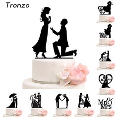 wedding cake topper with silhouettes of bride and groom on each tier, surrounded by pink flowers