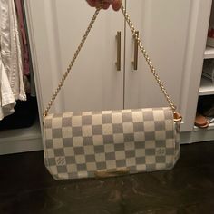 (Can Ship Today) Louis Vuitton Damien Azur Favorite Mm Purse. This Purse Can Be Worn As A Crossbody, But Strap Can Be Taken Off And Used As A Clutch. White And Grey Exterior Is Complimented By Gold Hardware. Great Used Condition! -Leather Strap In Excellent Condition. No Stains. Has Turned A Darker Color Naturally Over Time. -Interior Has A Few Very Small Minor Stains. Purse Is 100% Authentic, Purchased In Paris. This Style Is Discontinued And Can No Longer Be Purchased In Stores! Black And White Louis Vuitton Bag, Grey Louis Vuitton Bag, Louis Vuitton Handbags White And Gray, Louis Vuitton Cherry Blossom White Pochette, Silver Louis Vuitton Bag, Favorite Mm, Grey Exterior, Gold Hardware, Dark Colors