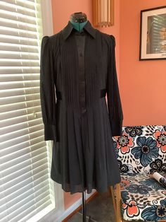 Beautiful Long Sleeve Silk Dress Made by Laundry by Design Tuxedo front buttons  Collared Satin button front strip and waist belt attached Pleated skirt 4" Cuffs Completely lined Knee length  Size 8 Shoulders -15 1/2" Sleeves -25" Bust -38 1/2" Waist -34" Hip - Free Length - 37 1/2" Excellent vintage condition, Beautiful No damages Long Sleeve Silk Dress, Vintage Tuxedo, Fernandina Beach, Dress Clothes For Women, Waist Belt, Silk Dress, Pleated Skirt, Dress Making, Black Shirt