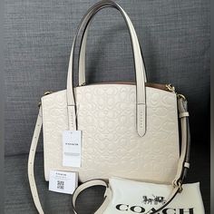 Brand New Hard To Find Coach Signature Satchel Handbag Genuine Leather Ivory Color Gold Hardware Dual Handles 4" Drop Detachable Atjustable Long Strap Two Compartments Divided By Therd Zippered One Interior: One Deep Slip Pocket Approximately 11”L 8.5”H 4.5"W (Max) Four Feet On The Bottom High Class Elegant Upscale Purse Dust Bag Is Available By Request Please See My Entire Collection Coach White Satchel With Detachable Strap, Coach Cream Bag For Errands, Cream Satchel With Detachable Strap For Shopping, Designer Cream Bag With Detachable Strap, Designer Cream Bags With Adjustable Strap, Designer Cream Satchel With Dust Bag, Designer Coach Shoulder Bag In Cream, Designer Cream Satchel With Double Handle, Designer Cream Satchel