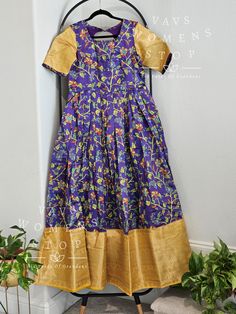 Product Title: Kalamkari Benarasi Silk Long Frock This beautiful long frock is a perfect blend of traditional Indian design and modern style. Made from high-quality Kalamkari Benarasi silk, this dress is a must-have for any fashion-forward woman. The intricate Kalamkari print adds a touch of elegance and the silk fabric gives it a luxurious feel. Customized Size L: This long gown is available in size L, but can also be altered to a medium size upon request. This ensures a perfect fit for every b Bollywood Tussar Silk Dress In Traditional Drape, Festive Banarasi Silk Straight Kurta Dress, Festive Banarasi Silk Dress In Straight Kurta Style, Traditional Dress With Kalamkari Print For Festivals, Banarasi Silk Straight Kurta Dress For Festive Occasions, Traditional Multicolor Maxi Dress For Diwali, Traditional Cotton Silk Gown For Festive Occasions, Traditional Full-length Gown With Pallu, Bollywood Tussar Silk Dress With Traditional Drape