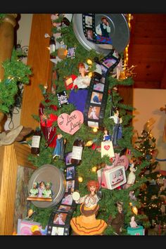 a christmas tree decorated with pictures and magnets