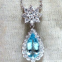 2.68ct Natural Aquamarine Diamonds Necklace Pear Shaped And Full Cut Vibrant Blue Aqua Color 13.3 X 7.4mm 1.05ct. Diamonds. Rounds Full Cut Brilliants Vs-2 Clarity G-Color. Overall Pendant: 31 X 12mm 17 Inches Necklace 14kt White Gold. Grand Weight: 5.5 Grams Appraisal Will Accompany For: $6,000 Luxury Blue Pear-shaped Necklace, Blue Pear-shaped Diamond Necklace, Pear-shaped Blue Brilliant Cut Jewelry, Diamonds Necklace, Aqua Color, Vibrant Blue, Natural Aquamarine, Pear Shaped, Aquamarine