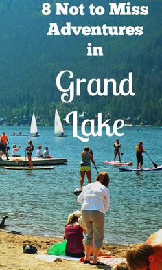 people are on the beach with boats and canoes in the water, text reads 8 not to miss adventures in grand lake