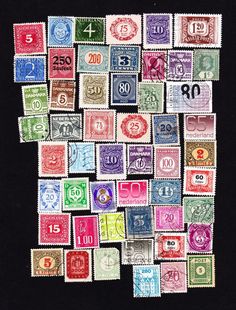 many different colored stamps are arranged in the shape of a square frame on a black background