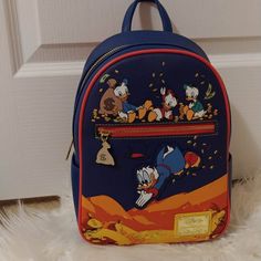 Nwt Price Is Firm Not Accepting Offers Any Offers Will Be Kindly Ignored Or Declined Disney Loungefly Ducktales Coins Mini Backpack Brand New With Tags Selling As Is New With Tags Please See All Pics Discontinued Approx Size 11 1/2" H X 9" W X 5" D No Price Police/No Rude Comments No Trades/No Holds All Items Are Always Triple Protect Before Mailing Out And Pics Are Taken During Packaging And Recorded Smoke Free Home Always Drama Free Zone Fast Shipper Same Day Or Next Day Shipping If Purchased Disney Bags For Daily Use And Back To School, Blue Backpack With Case For Everyday Use, Disney Leather Backpack For Everyday Use, Disney Leather Backpack, Blue Disney Bag With Zipper Closure, Disney Bags For Everyday Use And Back To School, Blue Disney Bags With Zipper Closure, Disney Blue Bags With Zipper Closure, Disney Backpack For Everyday Use