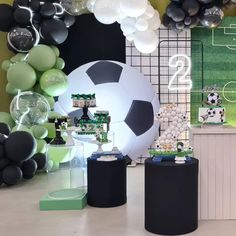 a soccer themed party with balloons and decorations