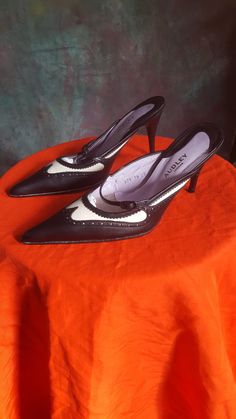 These stunning shoes are a fine combination of high quality master craftmanship with beautiful style and fashion credentials.  They are a 1990s shoe but are bank on for contemporary use with their fabulous sling back style and gorgeous spats style black and white leather combination uppers. They are leather soles and leather uppers with a mid height heel at 9cm tall. They are in fantastic vintage condition wth minimal signs of wear on the upper and soles as shoes in the photos  They are truly fa Audley Shoes, 1990s Shoes, Sling Back Shoes, Back Shoes, High End Shoes, Stunning Shoes, Sling Back, Pump Shoes, Women's Pumps