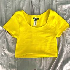 Nwot Never Worn Size Small But Can Fit An Xs Cropped Is This Your First Purchase On Poshmark? Use Promo Code "Giannis_fan" For $10 Off Your First Order! Yellow Stretch Short Sleeve Crop Top, Casual Yellow Seamless Tops, Fitted Yellow Seamless Crop Top, Yellow Seamless Summer Top, Fitted Yellow Scoop Neck Top, Yellow Fits, Yellow Crop Top, Girly Bags, Pink Car