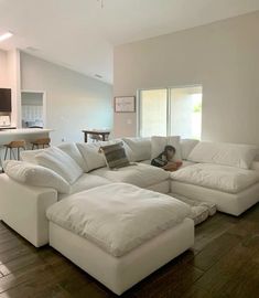 a large white sectional couch in a living room