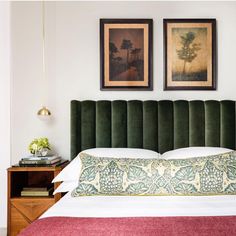 an instagramted photo of a bed with green velvet headboard and foot board