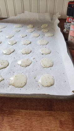 a pan filled with cookies on top of a wooden table