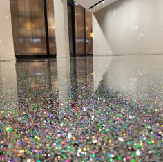 the floor is shiny and has many colors