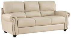 a cream colored leather sofa with studded arms and nail accents on the armrests