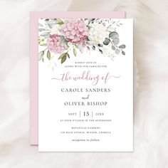 a wedding card with pink flowers and greenery