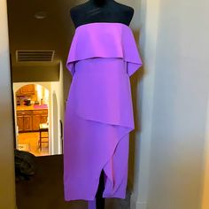 a purple dress on display in a room