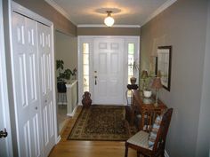 the hallway is clean and ready to be used as a living room or dining area