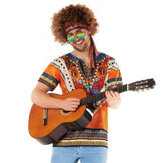 PRICES MAY VARY. Our groovy hippie costume for men comes with orange hippie top and matching head-tie, brown curly wig, peace necklace and rainbow ombre sunglasses Costume comes in 5 sizes! Medium, Large, XL, 2Xl and 3XL. Please see our size guide found in images for more information Hippie clothes for men that are perfect for 70s and decades parties, comfortable to wear all night long and designed with a Morph Costumes original hand-drawn print Founded in 2009 by 3 friends with a passion for co Orange Hippie Top For Festival, Orange Hippie Tops For Festival, 70s Hippie Aesthetic Outfit, Mens 70s Costume, Mens 70s Outfits, Hippie Guy, Hippie Aesthetic Outfit, 70s Hippie Aesthetic, 70's Outfits