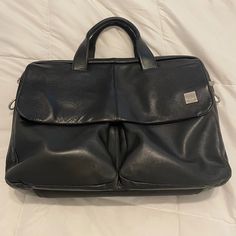 This Is A Used Knomo London Warwick Black Leather Messenger Bag. The Flap That Covers The Two Front Pockets Has A Magnetic Closer, And There Are Multiple Internal Pouches And Zip Pockets To Organize All Of Your Essentials. Padded Main Compartment Fits Laptops Up To At Least 15.5 (I Have One). Besides Having A Few Minor Scuffs (They Do Not Show In Pictures) The Only Sign Of Wear Is On The Handles. Some Of The Outer Layer Of Stitching Has Loosened. The Inner Stitching Is Still Intact. No Strap. Black Shoulder Bag With Adjustable Strap For Business Trips, Black Tote Briefcase For Formal Use, Black Shoulder Bag With Detachable Strap For Business Trips, Black Bag With Adjustable Strap For Business Trips, Soft Leather Shoulder Bag For Business Trips, Black Bags With Adjustable Strap For Business Trips, Black Tote Satchel For Business Trips, Black Top Handle Satchel For Business Trips, Black Double Handle Bag For Business Trips