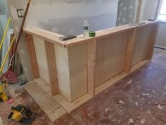 an unfinished counter in the middle of a room