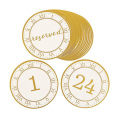 three gold coins with the number twenty two and four numbered numbers on each one side